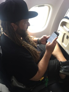 Mark writing our new mission statement on an Air Cal flight. 